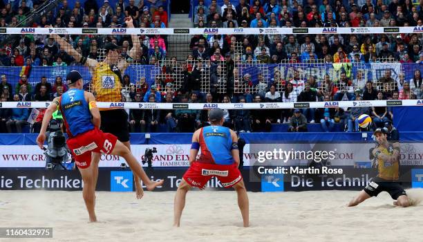 Julius Thole of Germany and Clemens Wickler in action during the match against Anders Mol and Christian Sorum o#2 f Norway on day nine of the FIVB...