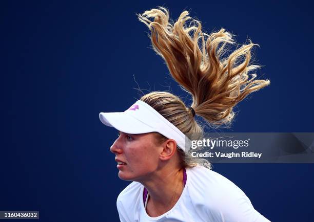 Ekaterina Alexandrova of Russia serves against Serena Williams of the United States during a third round match on Day 6 of the Rogers Cup at Aviva...