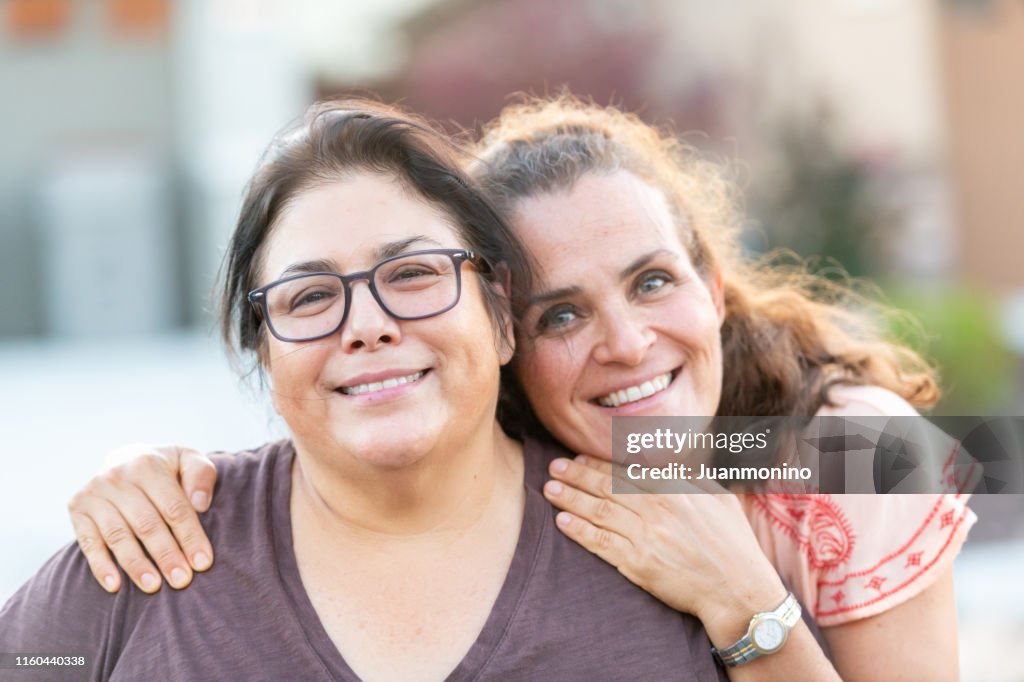 Mature Lesbian Multi Ethnic Couple Posing At Their Home Front Door High-Res  Stock Photo - Getty Images