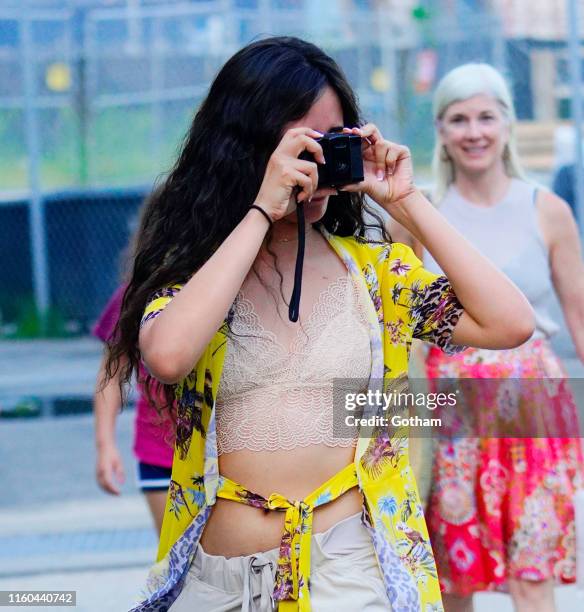 Camila Cabello takes a photo while out with Shawn Mendes on August 8, 2019 in New York City.