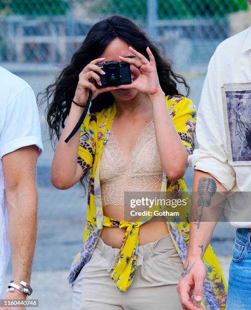 Camila Cabello takes a photo while out with Shawn Mendes on August 8, 2019 in New York City.