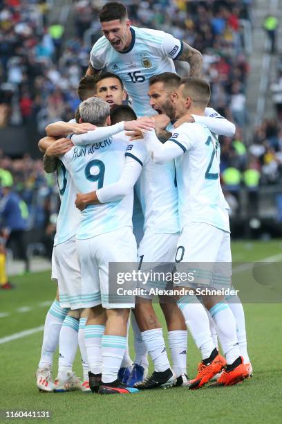 Sergio Aguero of Argentina celebrates with teammates after scoring the opening goal during the Copa America Brazil 2019 Third Place match between...