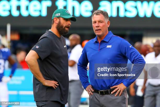 New York Jets head coach Adam Gase and New York Giants head coach Pat Shurmur talk prior to the National Football League pre-season football game...