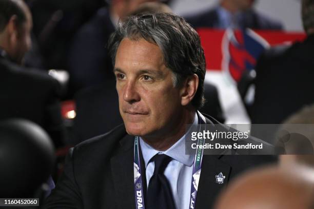 General manager Brendan Shanahan of the Toronto Maple Leafs look on from the team draft table during the first round of the 2019 NHL Draft at Rogers...