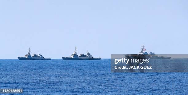 Photo taken on August 7 shows two Israeli Sa'ar 5 class corvette and the US Navy USS Donald Cook class guided missile destroyer during an exercise...