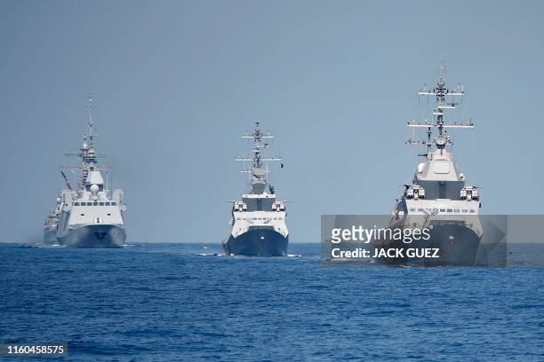 Photo taken on August 7 shows the French anti-submarine frigate FREMM Auvergne and two Israeli Sa'ar 5 class corvette during an exercise how simulate...