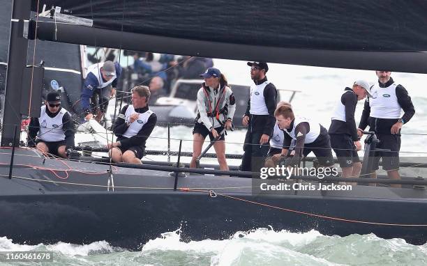 Catherine, Duchess of Cambridge at the helm competing on behalf of The Royal Foundation in the inaugural King's Cup regatta hosted by the Duke and...