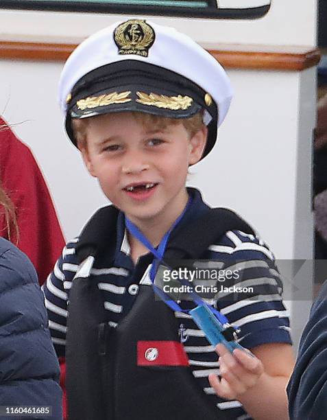 Prince George of Cambridge watches Catherine, Duchess of Cambridge at the helm competing on behalf of The Royal Foundation in the inaugural King's...