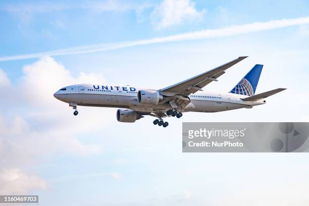 United Airlines Boeing 777-200 aircraft landing at London Heathrow International Airport in England, UK on 2 August 2019 during a summer day. The...