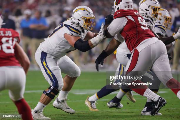 Los Angeles Chargers offensive guard Forrest Lamp blocks Arizona Cardinals defensive lineman Terrell McClain during the NFL preseason football game...