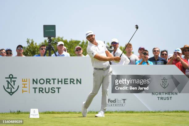Dustin Johnson watches his shot on the third tee during the second round of THE NORTHERN TRUST at Liberty National Golf Club on August 9, 2019 in...