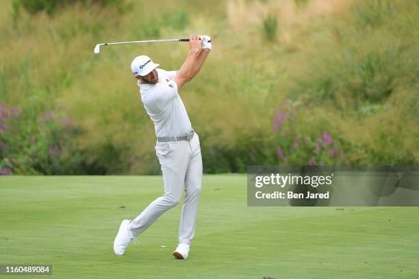 Dustin Johnson hits a shot on the ninth fairway during the second round of THE NORTHERN TRUST at Liberty National Golf Club on August 9, 2019 in...