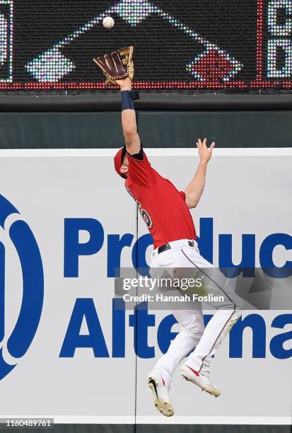 Max Kepler of the Minnesota Twins makes a catch in center field of the ball hit by Oscar Mercado of the Cleveland Indians during the first inning of...