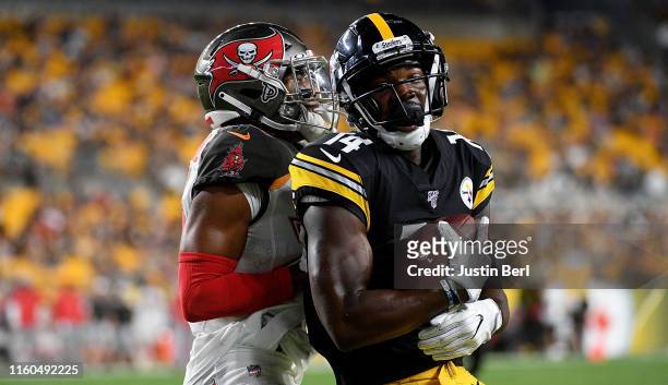 Tevin Jones of the Pittsburgh Steelers scores a touchdown in the second half during a preseason game against the Tampa Bay Buccaneers at Heinz Field...