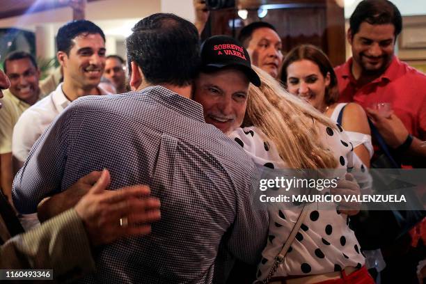 Panama's former president Ricardo Martinelli , detained a year ago on illegal wiretapping charges, is welcomed by family and friends at a private...