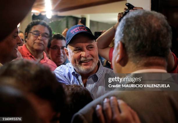 Panama's former president Ricardo Martinelli , detained a year ago on illegal wiretapping charges, is welcomed by family and friends at a private...