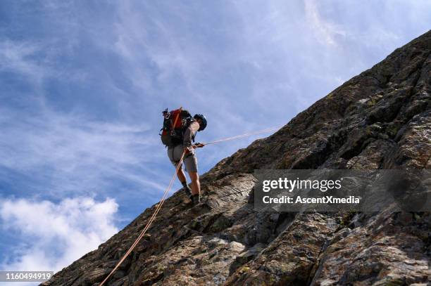 mountain adventure in the great outdoors - rappelling stock pictures, royalty-free photos & images