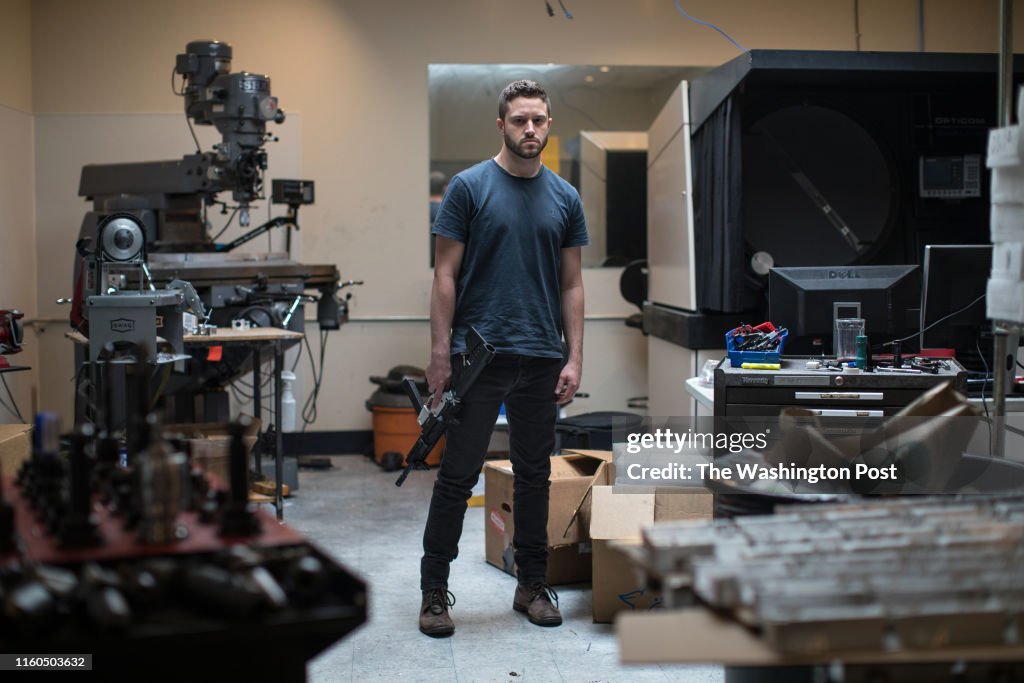 Cody Rutledge Wilson Cody Wilson, director of Defense Distributed, holds an AR-9 with a ...