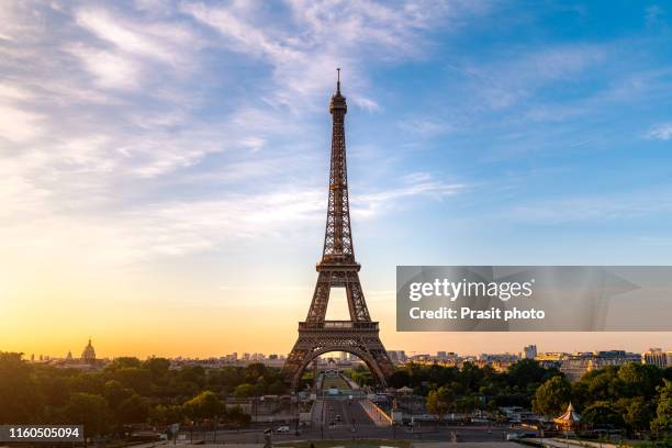 landscape panoramic view on the eiffel tower during the sunrise in paris, france. romantic travel background. - champs de mars stock pictures, royalty-free photos & images