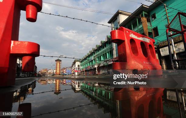 Barbed wire and barricades is used by Indian forces to block the road in city centre Lal Chowk the commercial hub of Srinagar as curfew continues to...