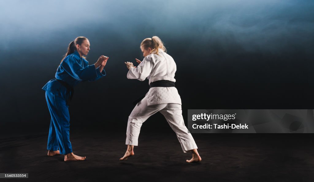 Female Judo Players Competing During Match