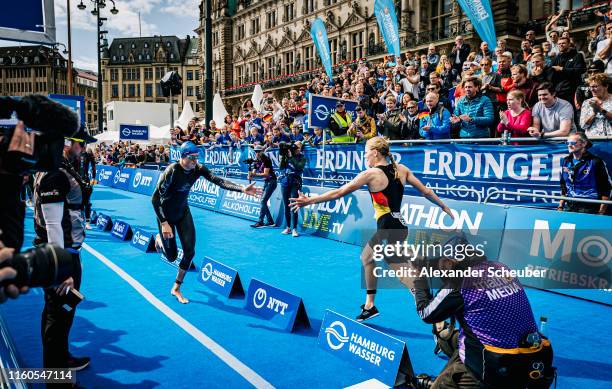 Valentin Wernz of Germany and Laura Lindemann of Germany compete in the ITU World Triathlon Mixed Relay World Championships on July 07, 2019 in...