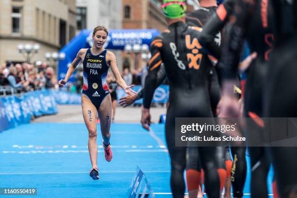 Cassandre Beaugrand of France shake hands with her team mate at the ITU Triathlon Mixed Relay World Championships during the Hamburg Wasser World...