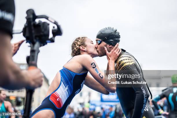 Cassandre Beaugrand of France kisses Sylvain Fridelance of Swizerland during the ITU Triathlon Mixed Relay World Championships during the Hamburg...