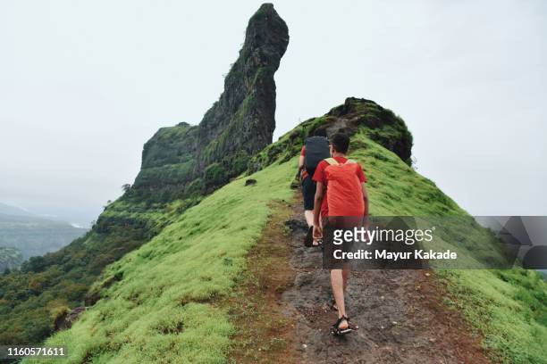 teenage boy looking at the view while hiking - monsoon stock pictures, royalty-free photos & images