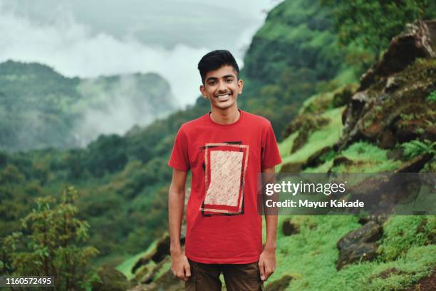 portrait of a teenage boy while hiking - indian boy portrait stockfoto's en -beelden