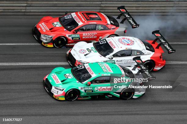 Nico Mueller of Switzerland and Audi Sport Team Abt Sportsline drives with Loic Duval of France Audi Sport Team Phoenix and Rene Rast of Germany and...