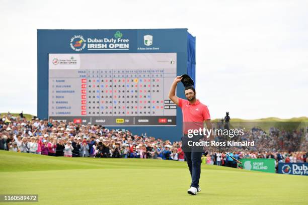 Jon Rahm of Spain waves to the crowd after his putt on the eighteenth hole during Day Four of the Dubai Duty Free Irish Open at Lahinch Golf Club on...