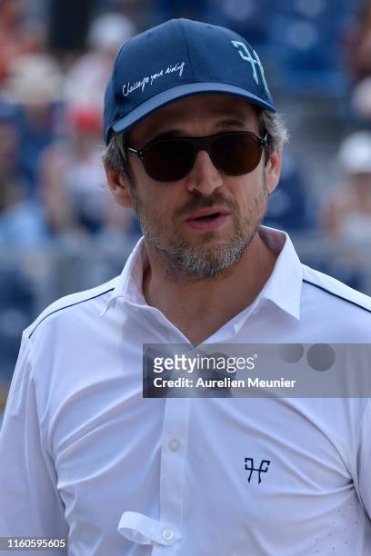 Guillaume Canet of France reacts on day three of the Longines Paris Eiffel Jumping in the Champ de Mars on July 07, 2019 in Paris, France.