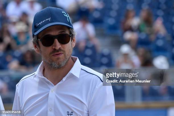 Guillaume Canet of France reacts on day three of the Longines Paris Eiffel Jumping in the Champ de Mars on July 07, 2019 in Paris, France.