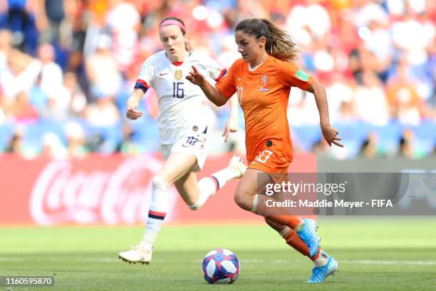 Danielle Van De Donk of the Netherlands runs with the ball under pressure from Rose Lavelle of the USA during the 2019 FIFA Women's World Cup France...