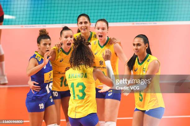 Players of Brazil celebrate a point during the 2019 FIVB Volleyball Nations League final match between the United States and Brazil at Nanjing...