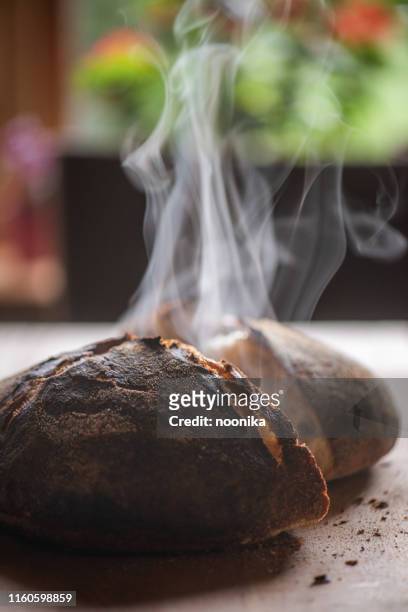 steaming sourdough - baking bread stock pictures, royalty-free photos & images