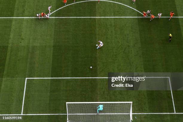 Megan Rapinoe of the USA scores her team's first goal from the penalty spot past Sari Van Veenendaal of the Netherlands during the 2019 FIFA Women's...