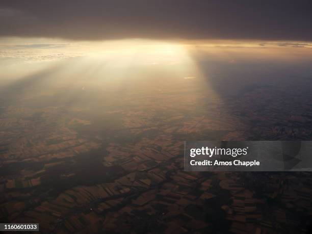 dramatic clouds seen from airplane. - amos chapple stock pictures, royalty-free photos & images