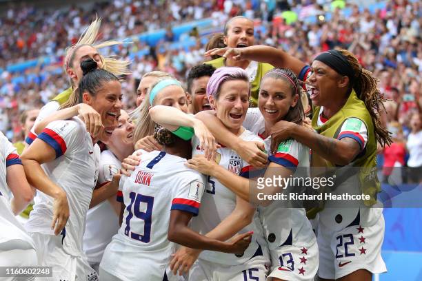 Megan Rapinoe of the USA celebrates with teammates after scoring her team's first goal during the 2019 FIFA Women's World Cup France Final match...