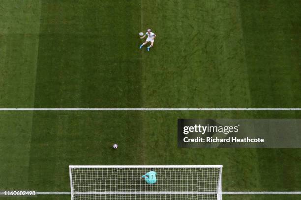 Megan Rapinoe of the USA scores her team's first goal from the penalty spot past Sari Van Veenendaal of the Netherlands during the 2019 FIFA Women's...