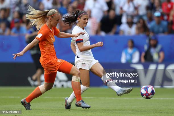 Alex Morgan of the USA shoots for goal under pressure from Stefanie Van der Gragt of the Netherlands during the 2019 FIFA Women's World Cup France...