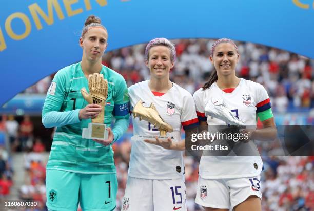 Sari Van Veenendaal of the Netherlands, golden glove, Megan Rapinoe of the USA, golden ball and Alex Morgan of the USA, silver boot pose with their...