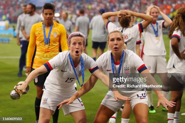 Megan Rapinoe and Allie Long of the USA celebrate with the FIFA Women's World Cup Trophy following their team's victory in the 2019 FIFA Women's...