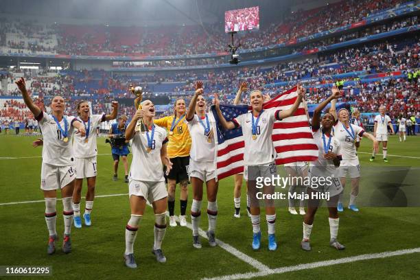 Players of the USA celebrate following their sides victory in the 2019 FIFA Women's World Cup France Final match between The United States of America...