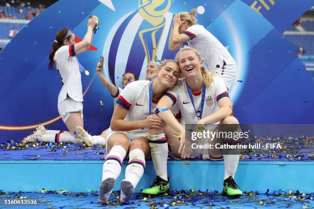 Abby Dahlkemper and Samantha Mewis of the USA celebrate victory in the 2019 FIFA Women's World Cup France Final match between The United States of...