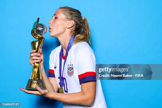 Allie Long of the USA poses with the Women's World Cup trophy after the 2019 FIFA Women's World Cup France Final match between The United State of...