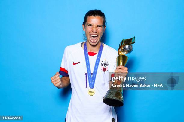 Tobin Heath of the USA poses with the Women's World Cup trophy after the 2019 FIFA Women's World Cup France Final match between The United State of...