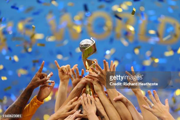 Players of the USA celebrate with the FIFA Women's World Cup Trophy following victory in the 2019 FIFA Women's World Cup France Final match between...