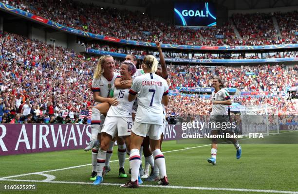 Megan Rapinoe of the USA celebrates with teammates after scoring her team's first goal during the 2019 FIFA Women's World Cup France Final match...